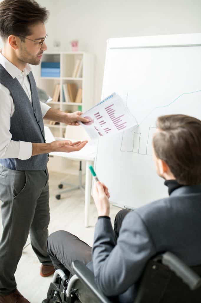 Coworker working with flipchart