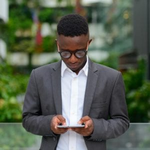 Young African businessman in the city outdoors